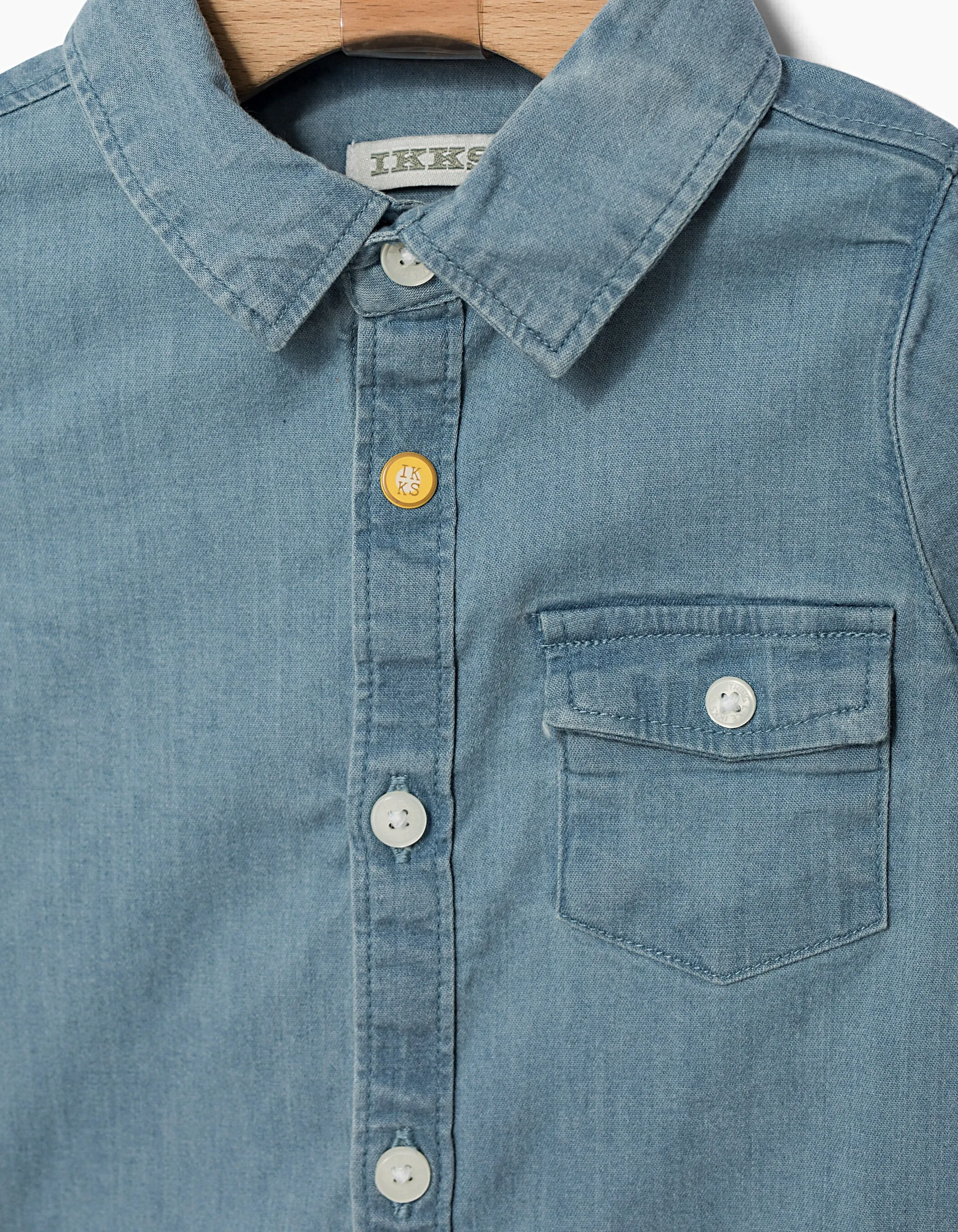 Baby boy's faded blue denim shirt