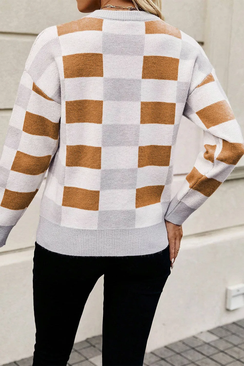 Pull kaki à carreaux et bords ctelés *